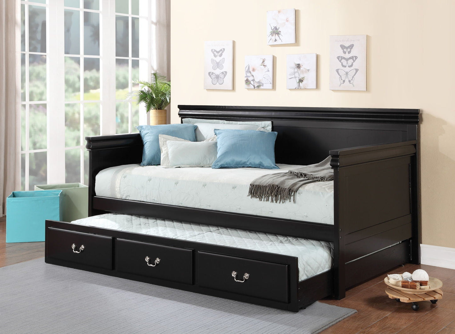 Bailee Twin Daybed Black with paneled headboard and built-in storage drawers, blue pillows on Tampa Home & Garden Store