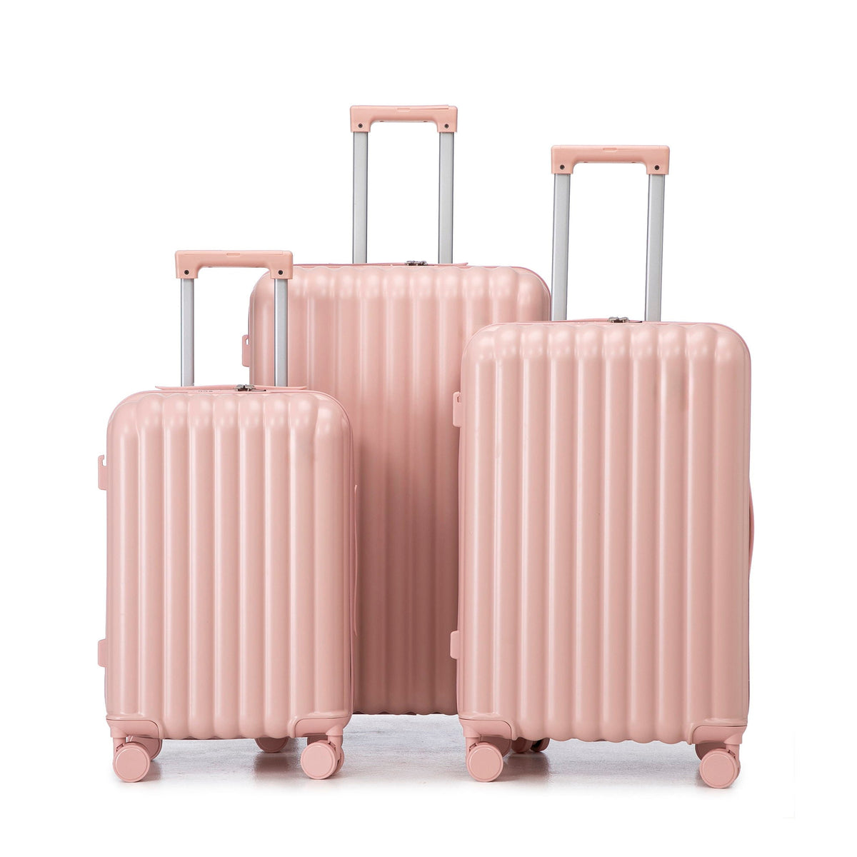 3-piece pink spinner luggage set with ribbed shells and telescoping handles on wheels on Tampa Home & Garden Store
