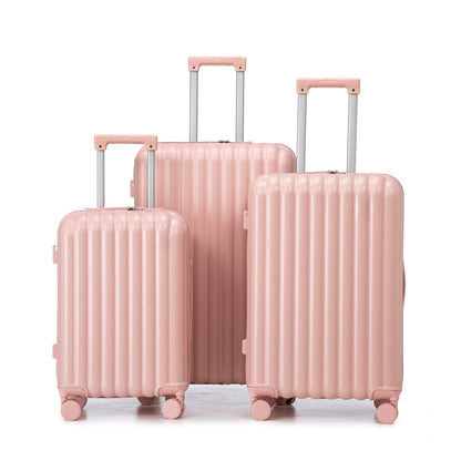 3-piece pink spinner luggage set with ribbed shells and telescoping handles on wheels on Tampa Home & Garden Store