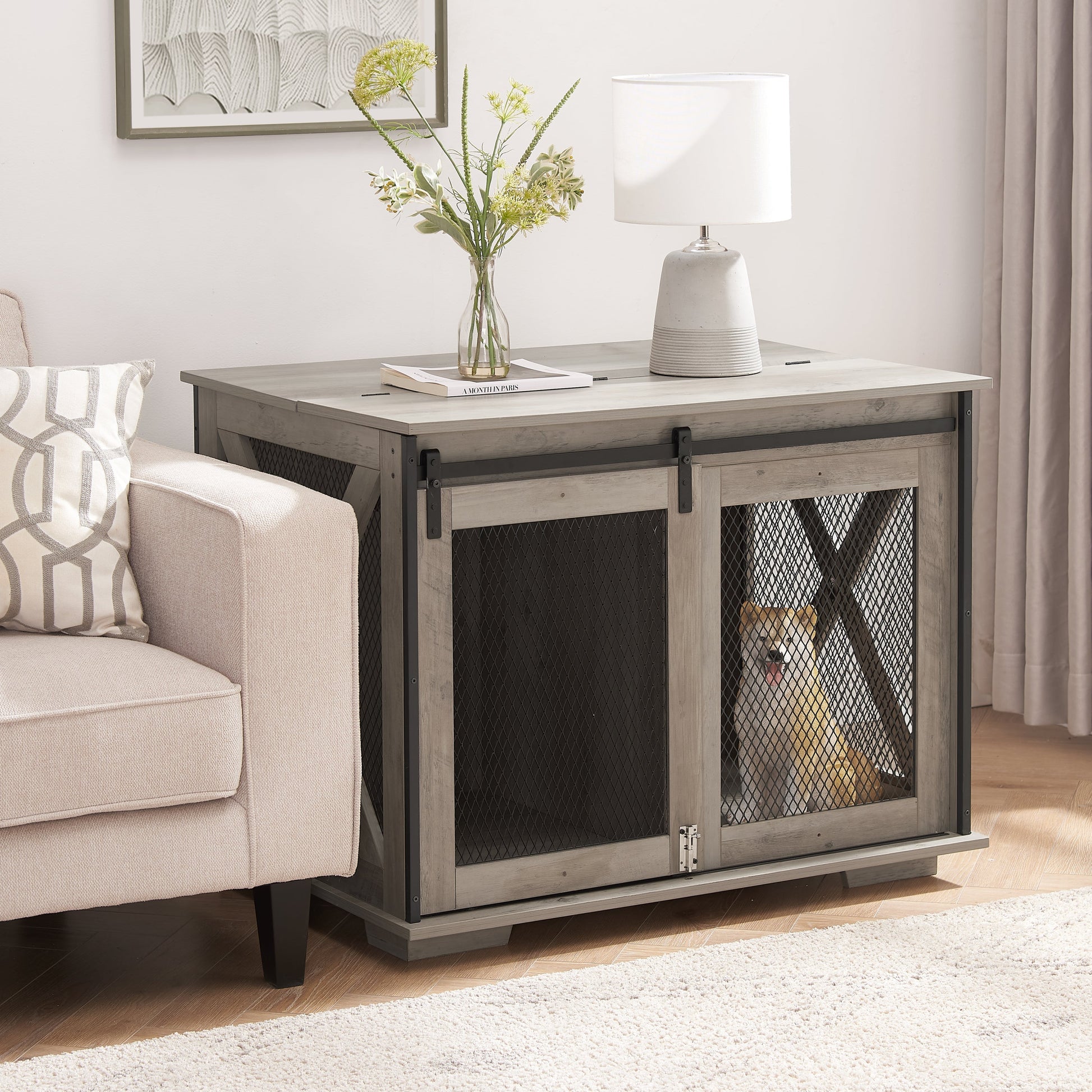 Farmhouse dog crate furniture with sliding barn door, greywashed wood and black mesh, dog inside on Tampa Home & Garden Store
