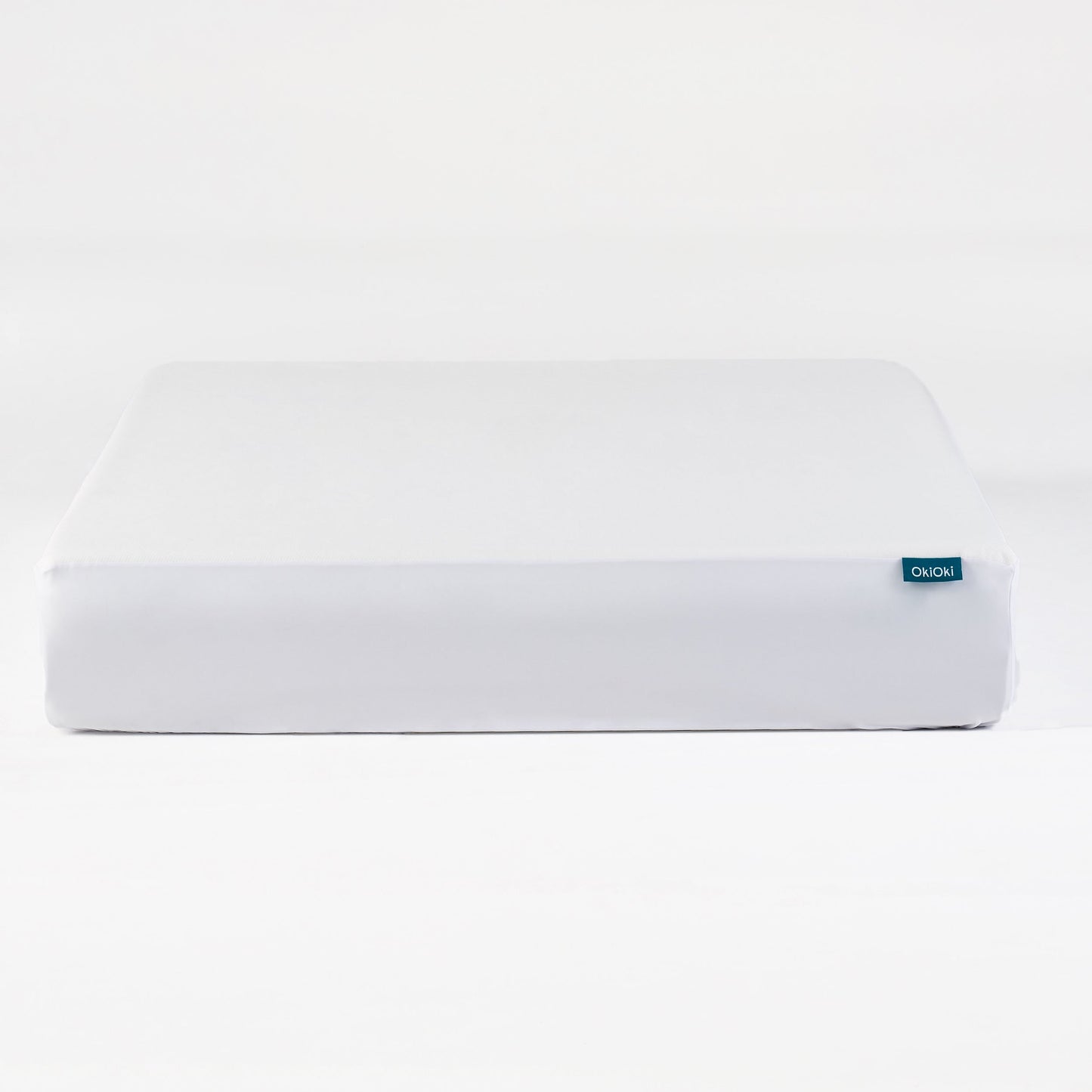 OkiOki King Mattress Protector white fabric with blue OkiOkI tag by HouseOfZazla on Tampa Home & Garden Store