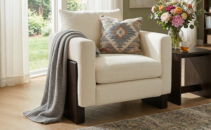 Modern accent chair in cream upholstery with dark rubberwood legs on Tampa Home & Garden Store