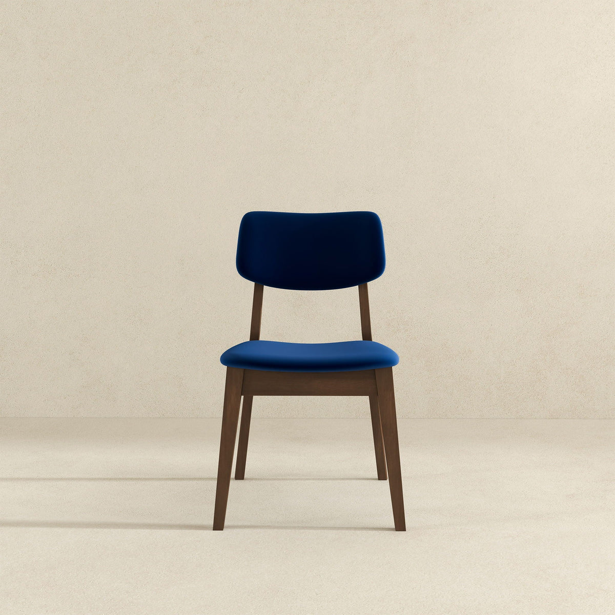Solid back side chair set in blue with mid-century modern design and wooden legs on Tampa Home & Garden Store