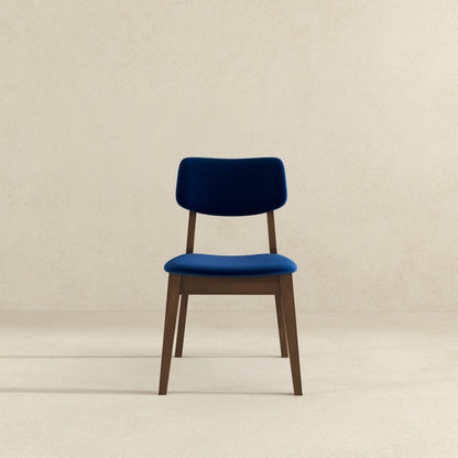 Solid back side chair set in blue with mid-century modern design and wooden legs on Tampa Home & Garden Store