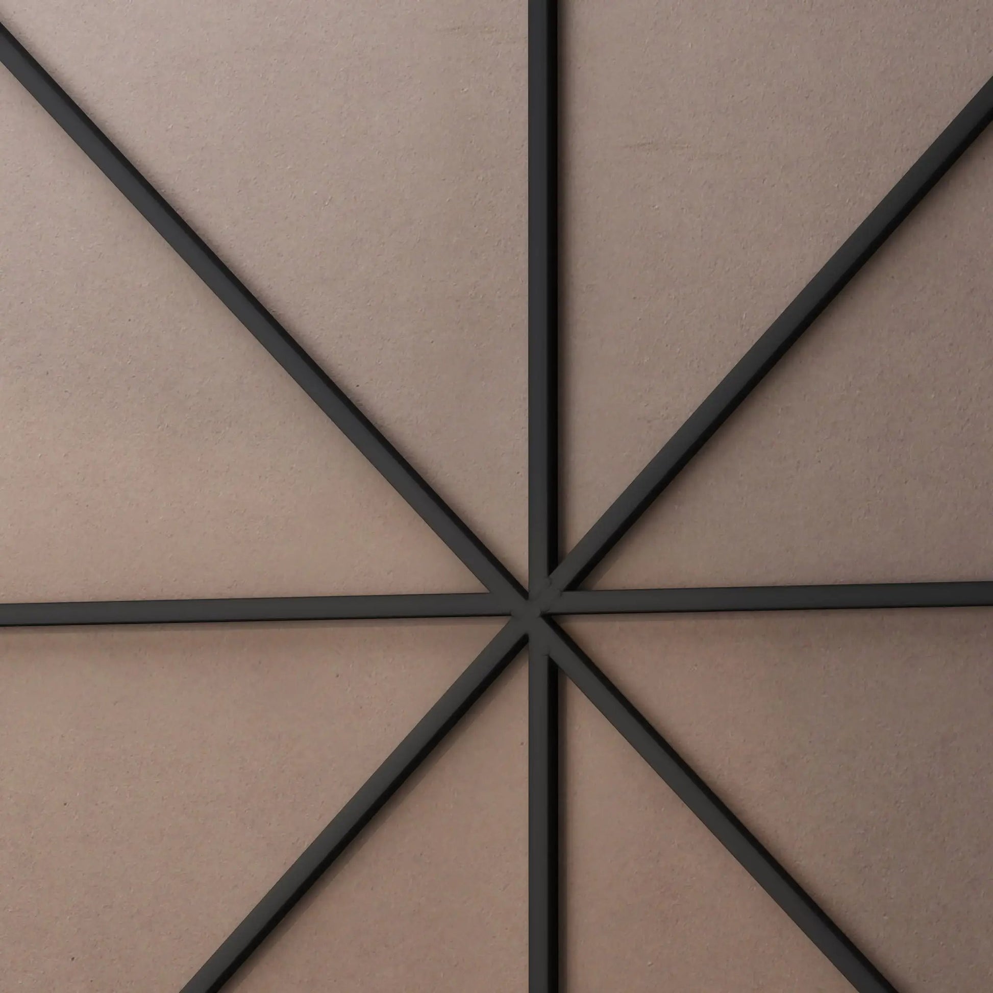 Wall mirror frame in black metal with intersecting diagonal bars forming a geometric design on Tampa Home & Garden Store
