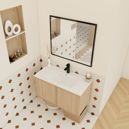 Floating vanity with sink in light brown wood, soft-close doors, black faucet, mirror on Tampa Home & Garden Store