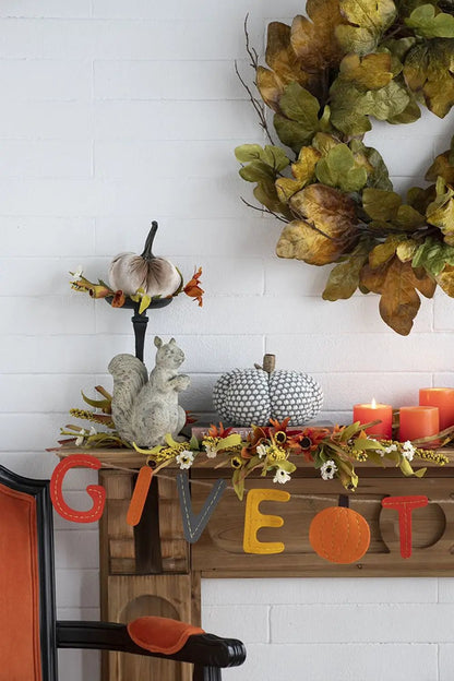Knite Pumpkin Ornament Decor gray pumpkin on black pedestal with autumn leaves on rustic mantel on Tampa Home & Garden Store