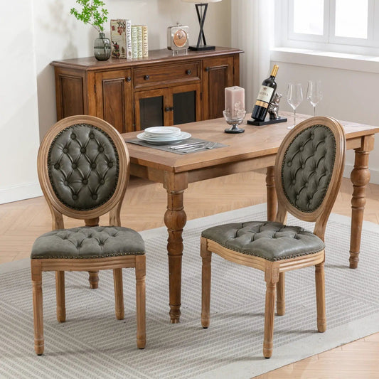 French style tufted dining chairs pair with green upholstery, solid wood frames and nailhead trim on Tampa Home & Garden Store
