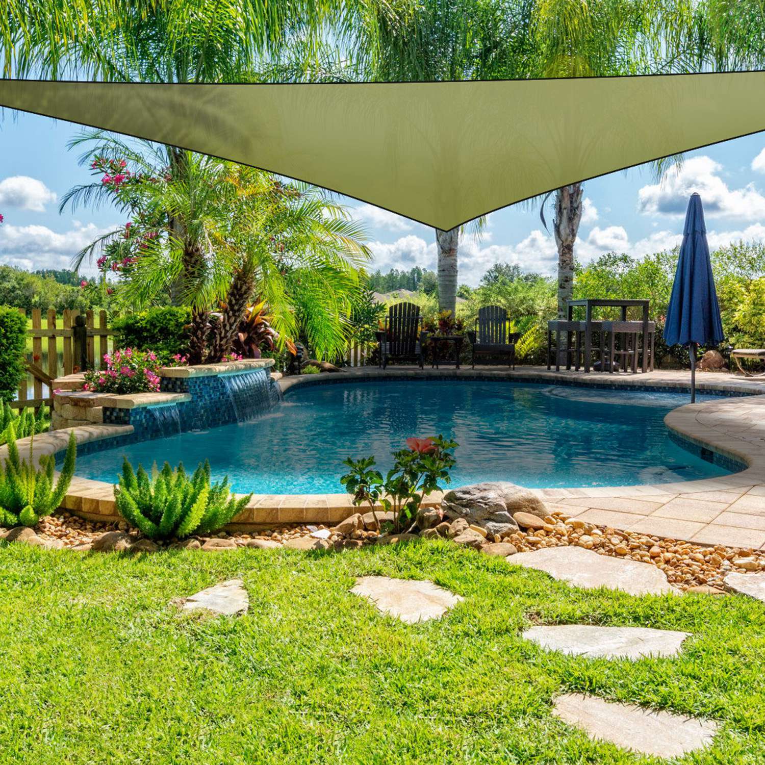GemGear triangle shade sail patio cover in tan over pool with palm trees and lounge chairs on Tampa Home & Garden Store