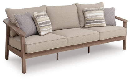 Harmony Headlands sofa with cushion in natural beige fabric, gray accent pillows, wooden frame on Tampa Home & Garden Store
