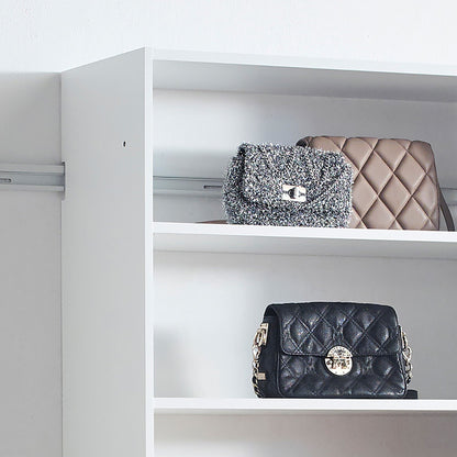 Wall-mounted wood closet system white wardrobe; black quilted handbag and tan quilted purse on Tampa Home & Garden Store