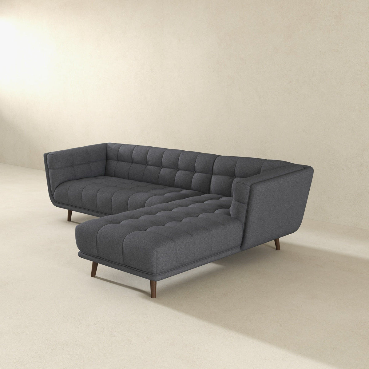 L-shaped sectional sofa tufted in dark gray fabric with mid-century wooden legs HouseOfZazla on Tampa Home & Garden Store