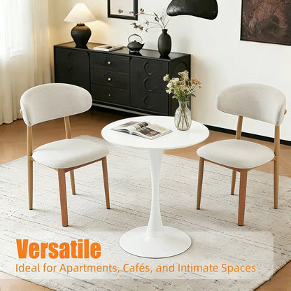 Round dining table with tulip-style white pedestal base, 4 cream chairs on Tampa Home & Garden Store