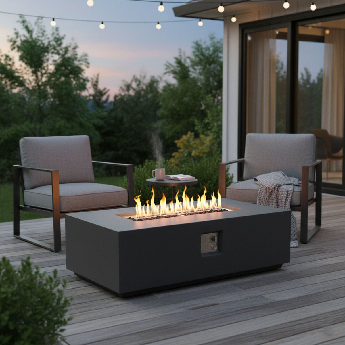 Rectangular fire pit table by HouseOfZazla, gray with 50k BTU flames, two chairs on a deck on Tampa Home & Garden Store