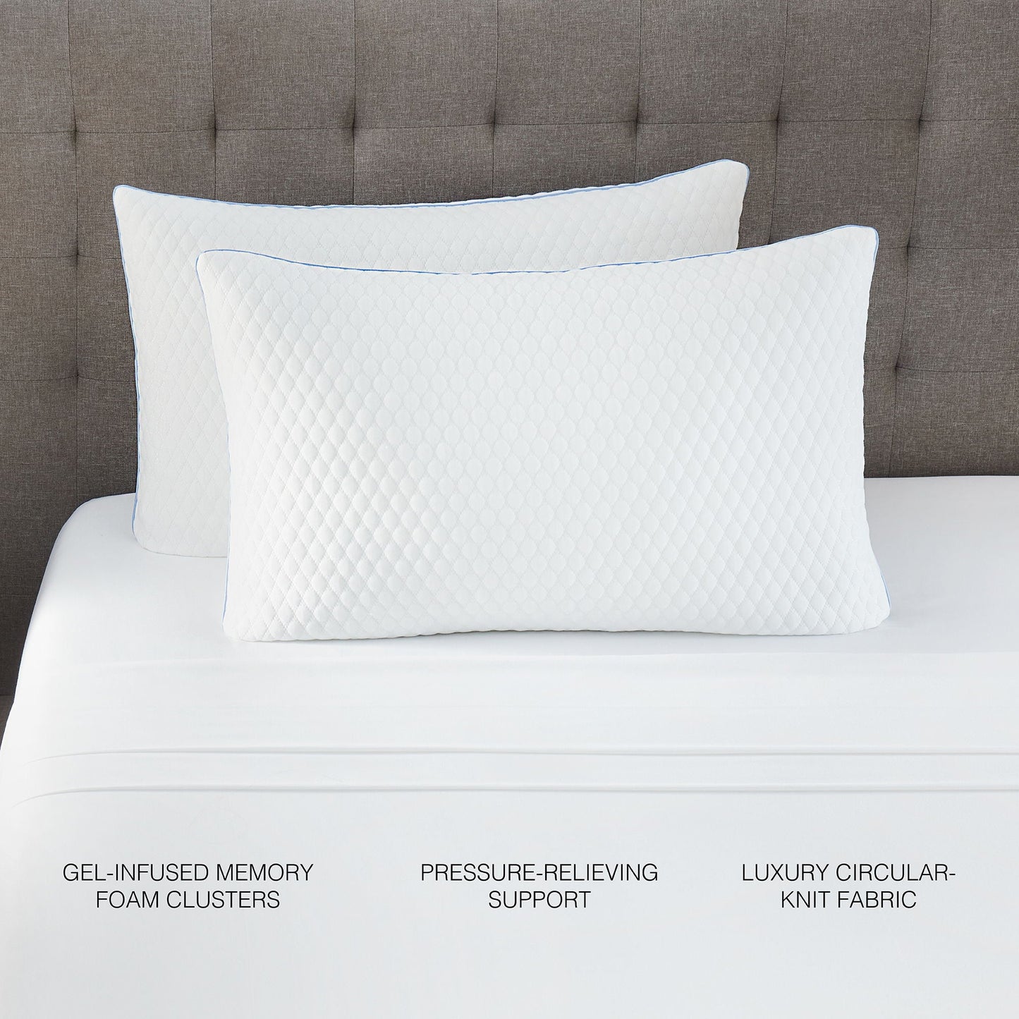 Pair of white quilted pillows with blue piping on a brown tufted headboard on Tampa Home & Garden Store