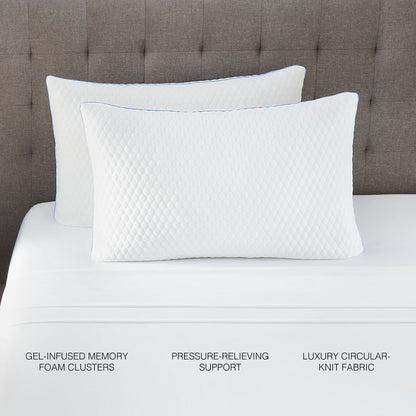 Pair of white quilted pillows with blue piping on a brown tufted headboard on Tampa Home & Garden Store