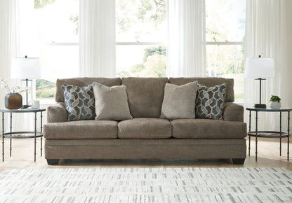 Stonemeade Living Room Set taupe sofa with geometric pillows, flanked by end tables and lamps on Tampa Home & Garden Store