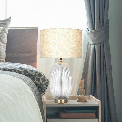 Aurora ribbed clear glass table lamp with a large beige linen shade and gold accents by HouseOfZazla on Tampa Home & Garden Store