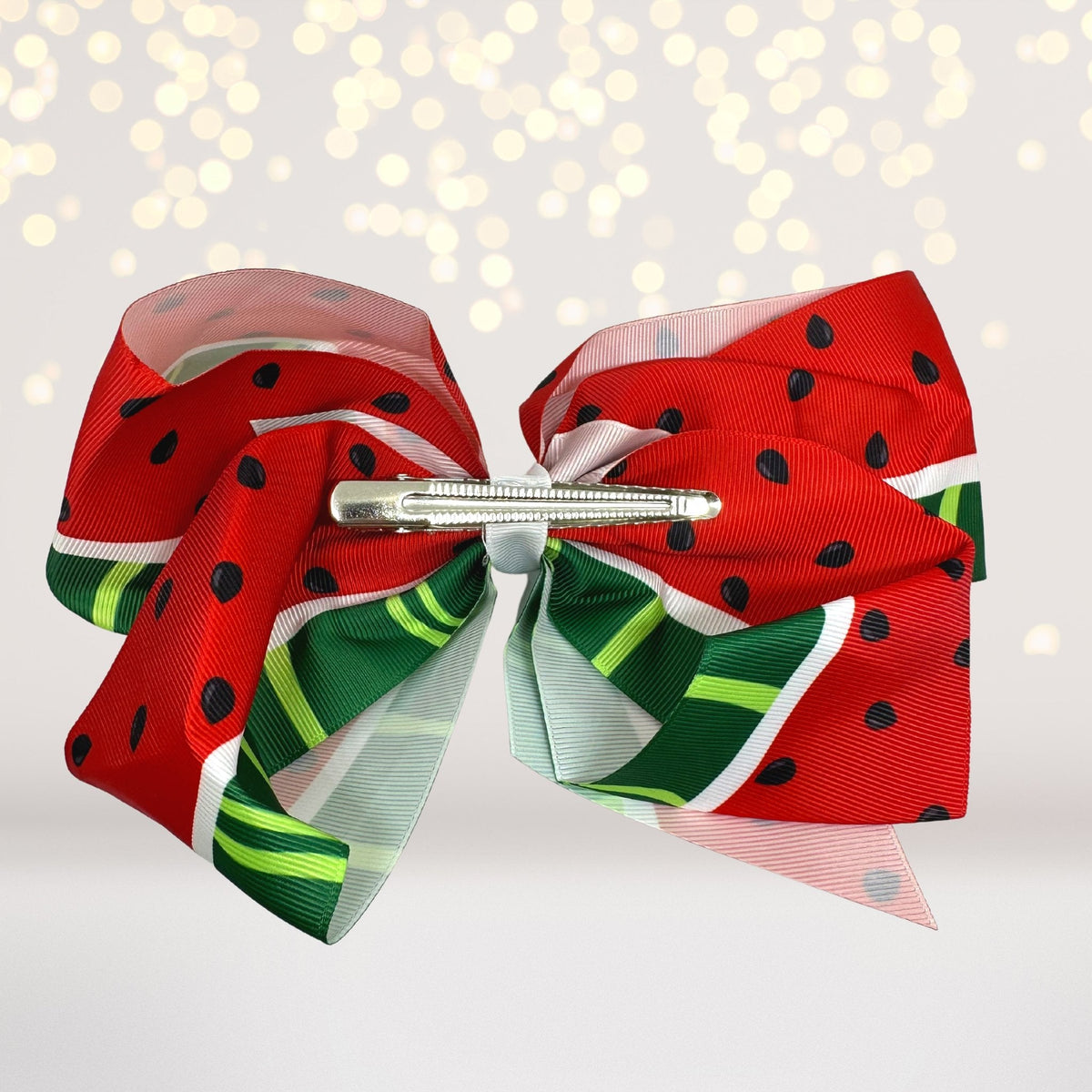 Hair bow set of 2 oversized fruit bows in watermelon pattern with red ribbons and green trim on Tampa Home & Garden Store