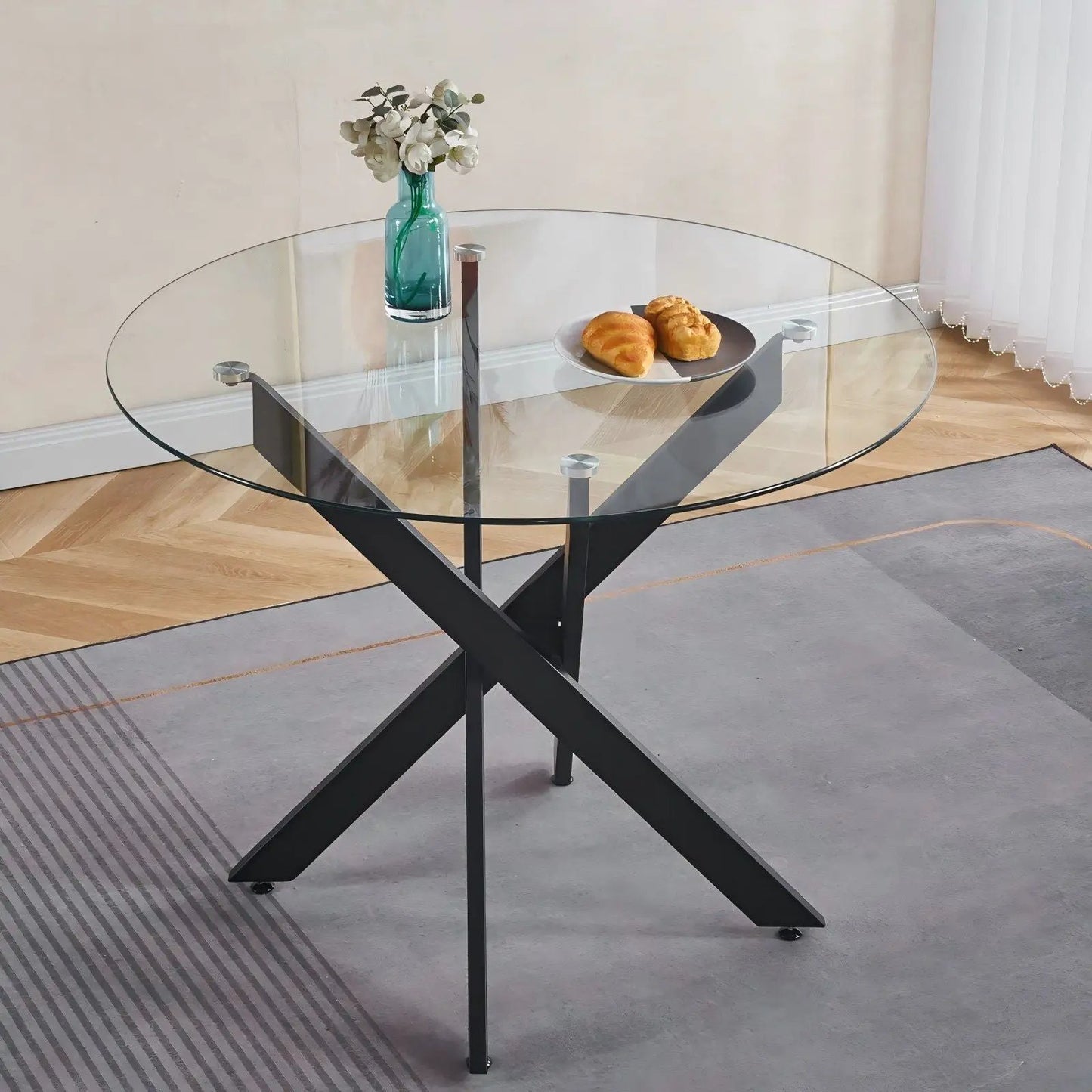 Dining table with cross metal legs and round tempered glass top, black frame on Tampa Home & Garden Store