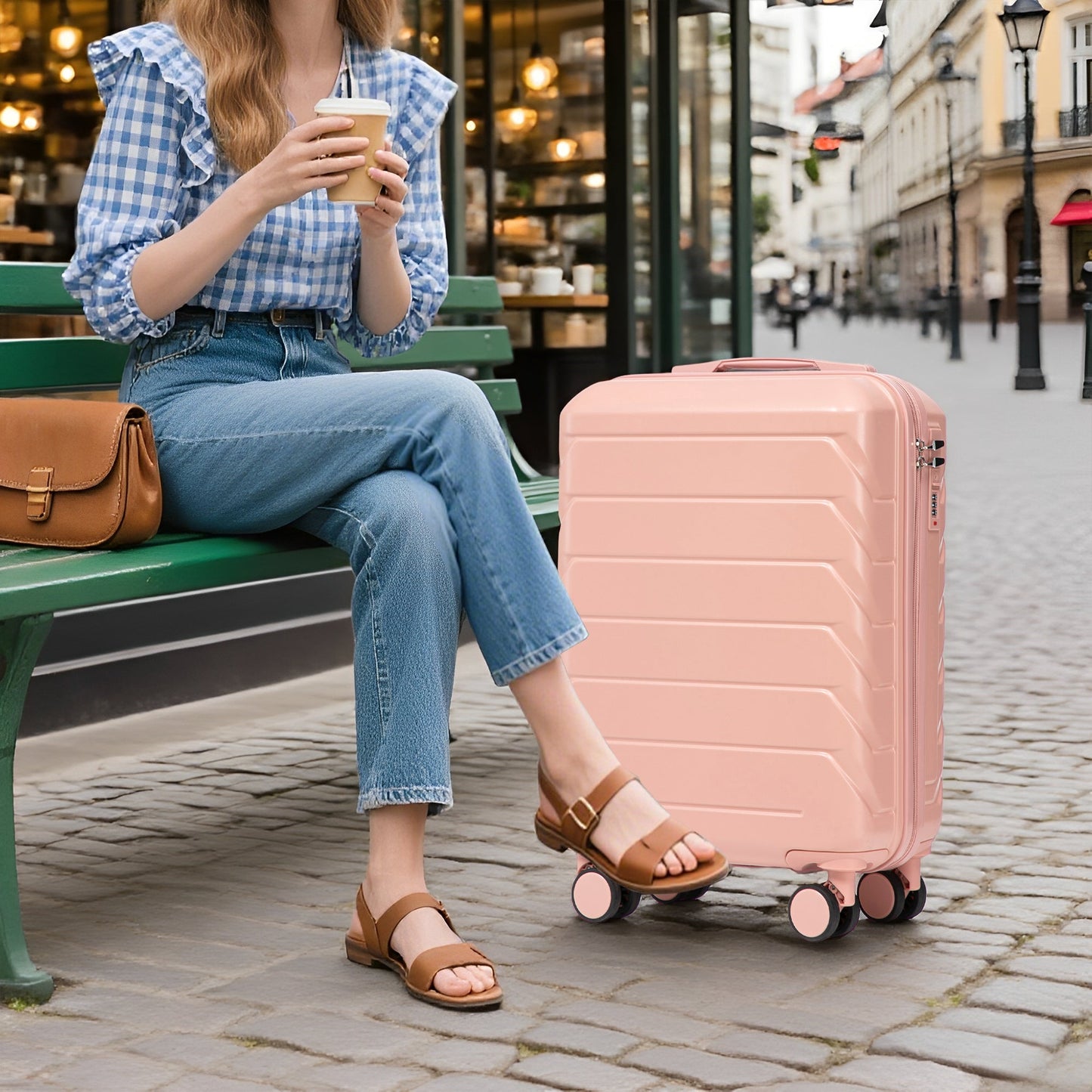 Pink 2-Piece ABS spinner luggage set with combo lock beside a seated woman on a city bench on Tampa Home & Garden Store