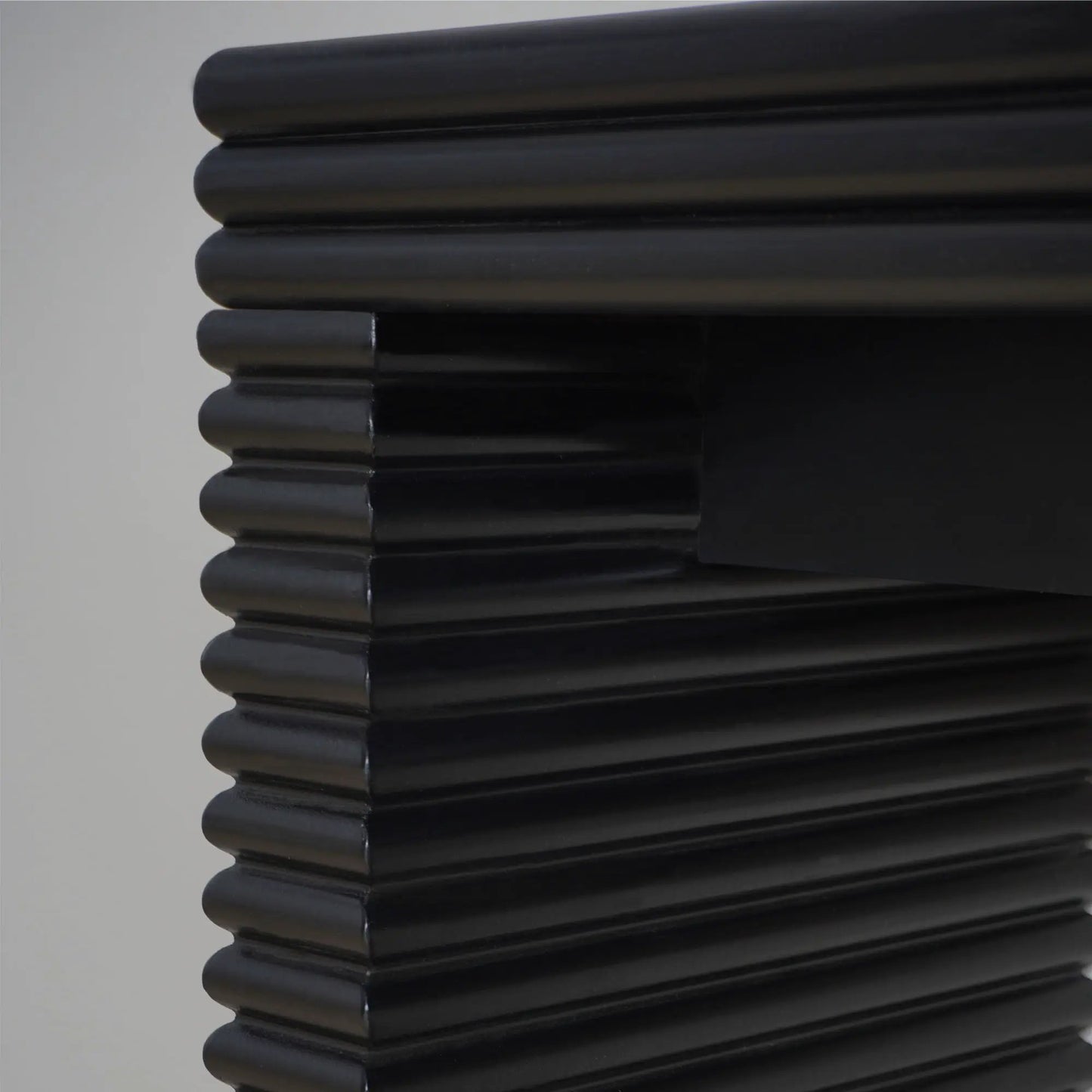 Modern Console Table with glossy black stacked ribbed cylindrical detailing on Tampa Home & Garden Store