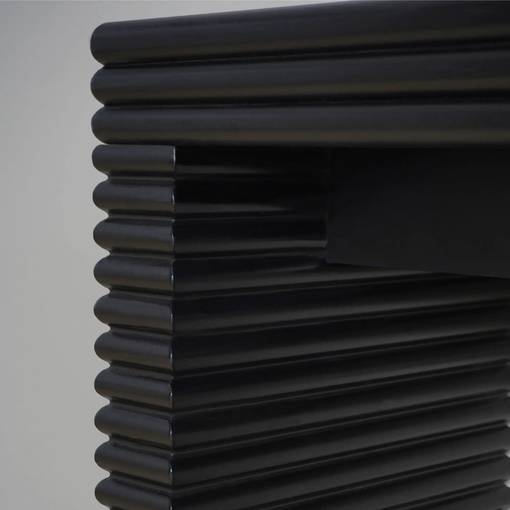 Modern Console Table with glossy black stacked ribbed cylindrical detailing on Tampa Home & Garden Store