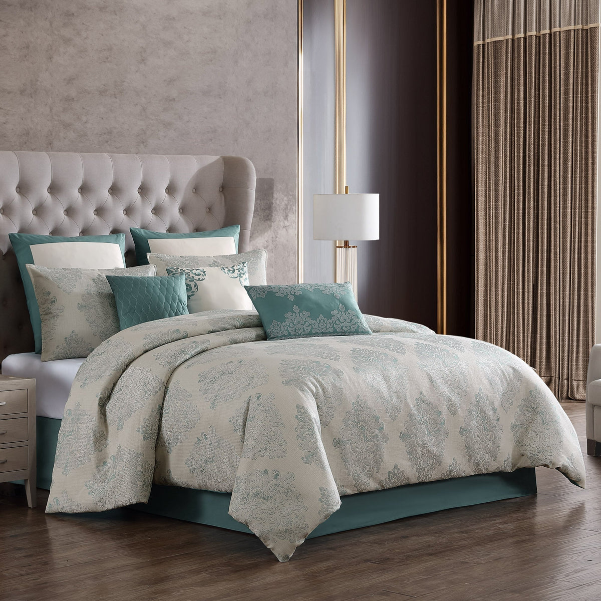 Marana 9 Pc Medallion Jacquard Comforter Set in pale gray with teal accents on a tufted bed on Tampa Home & Garden Store