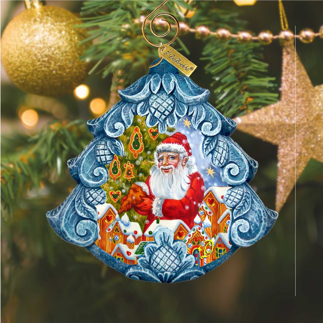 G. DeBrekht Santa Frosting the Gingerbread Tree Ornament in a blue hand-painted frame on Tampa Home & Garden Store