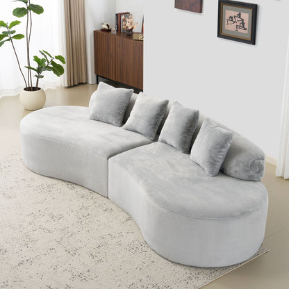 Modern Curved Sofa and the Soft Linen Pillows