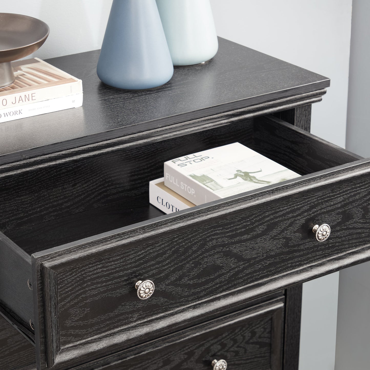 Modern 5-drawer black dresser by HouseOfZazla with dark wood grain and silver knob pulls on Tampa Home & Garden Store