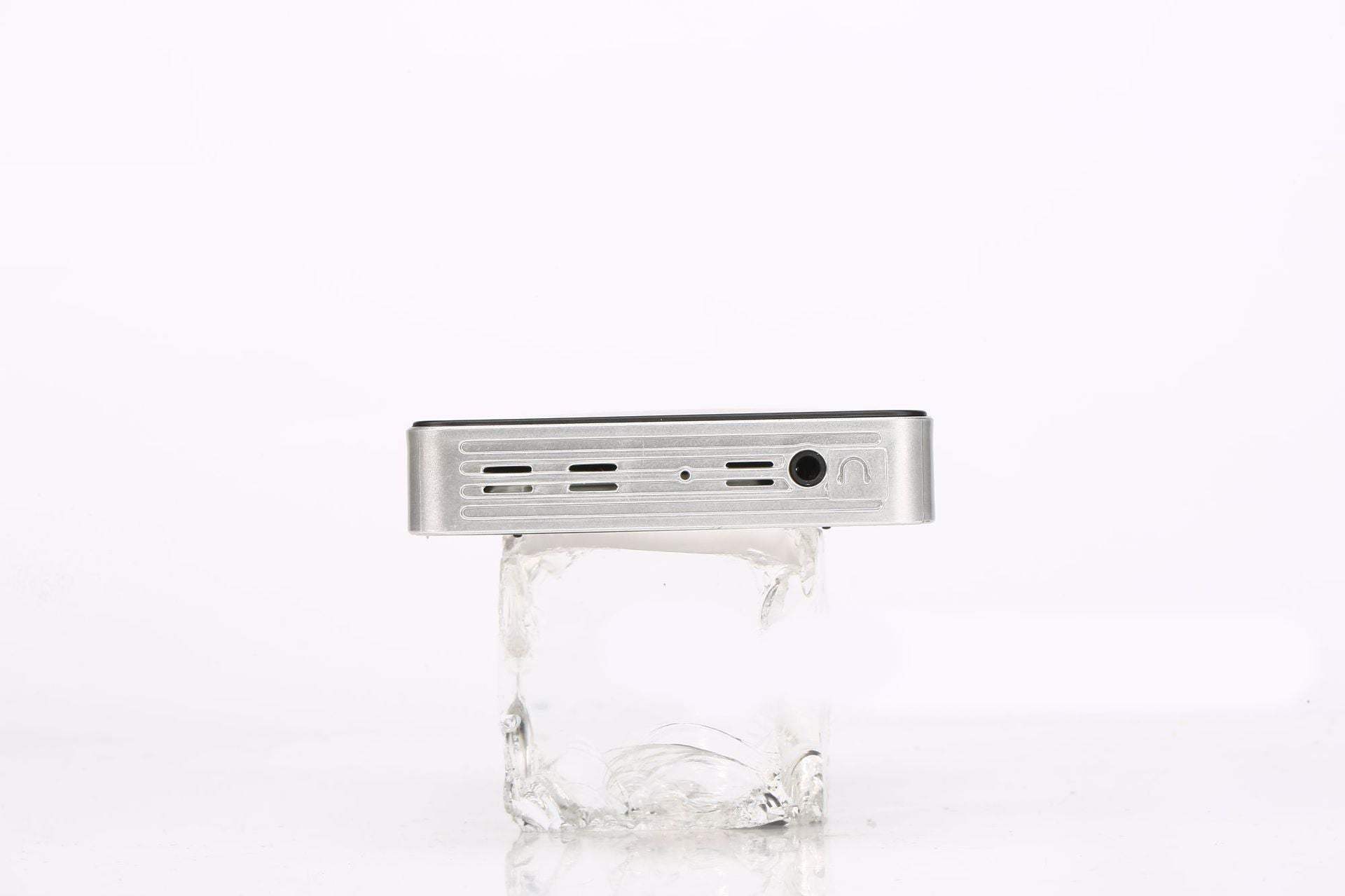 Home wireless projector, silver metal body with vented side panel and circular port on Tampa Home & Garden Store