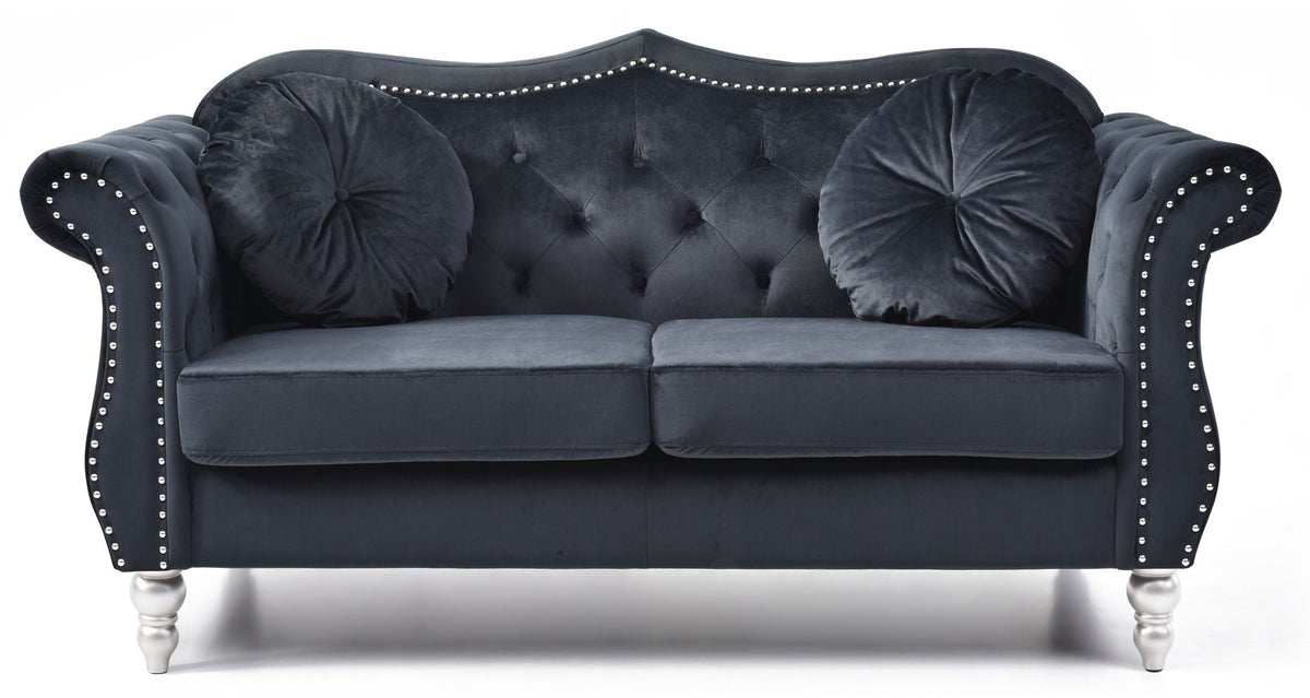 Stationary navy loveseat with flared arms and tufted back nailhead trim on Tampa Home & Garden Store
