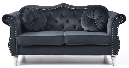 Stationary navy loveseat with flared arms and tufted back nailhead trim on Tampa Home & Garden Store