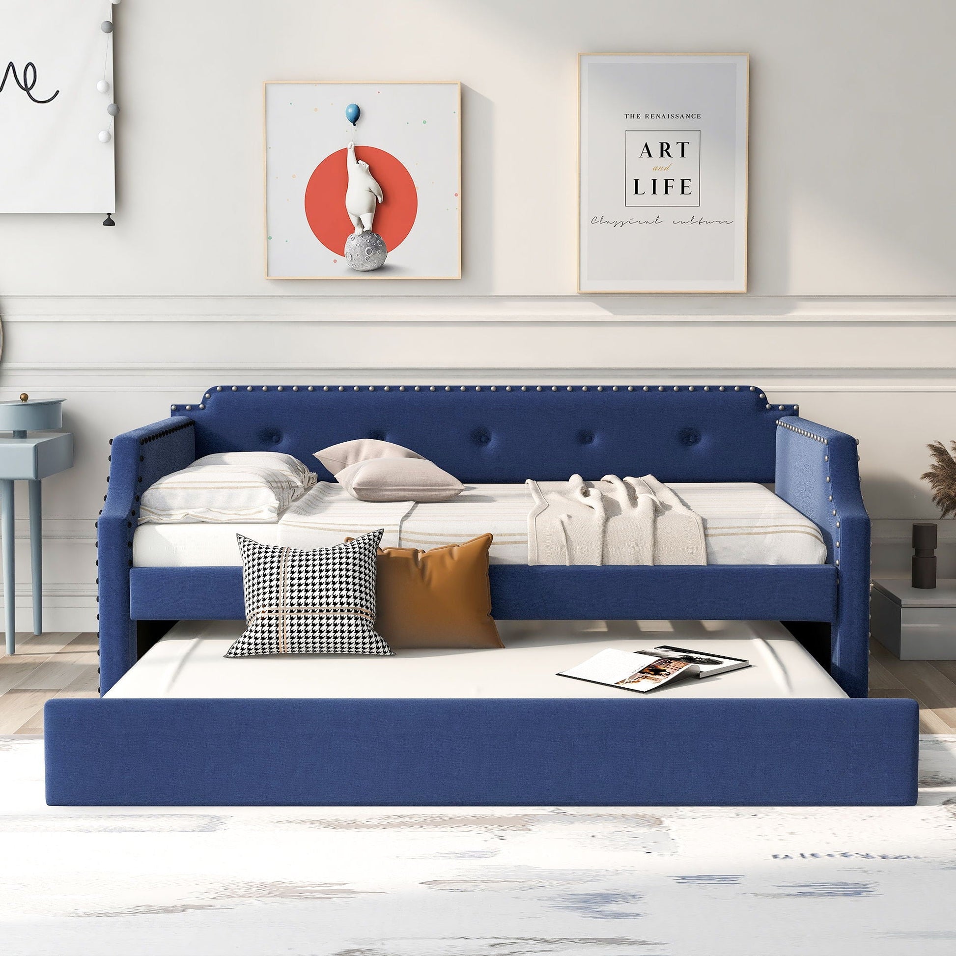 Blue upholstered daybed with pull-out trundle and nailhead trim on Tampa Home & Garden Store