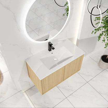 Floating bathroom vanity with sink combo, white countertop and light wood base, black faucet on Tampa Home & Garden Store