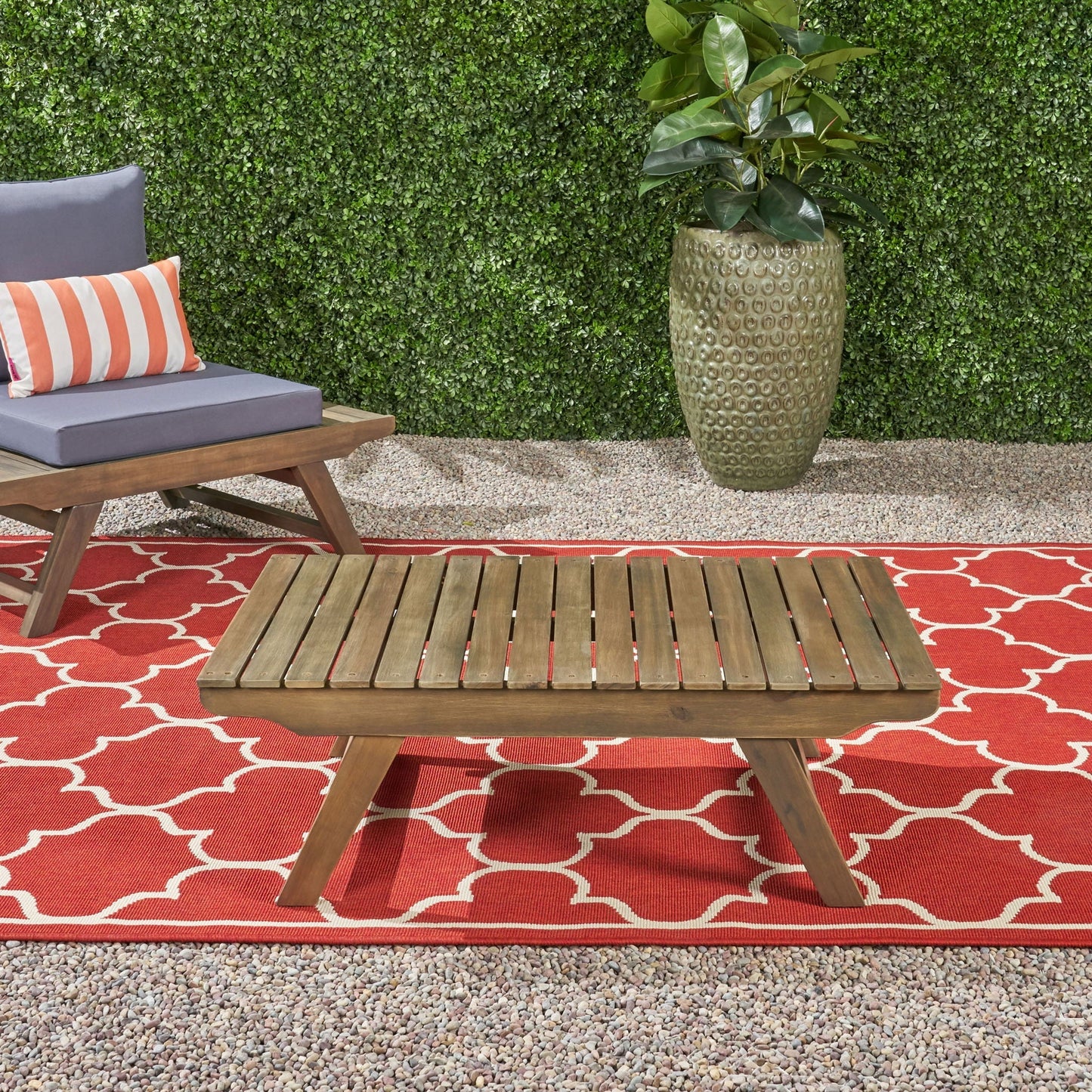 Outdoor acacia wood coffee table with open slat design in brown finish on Tampa Home & Garden Store
