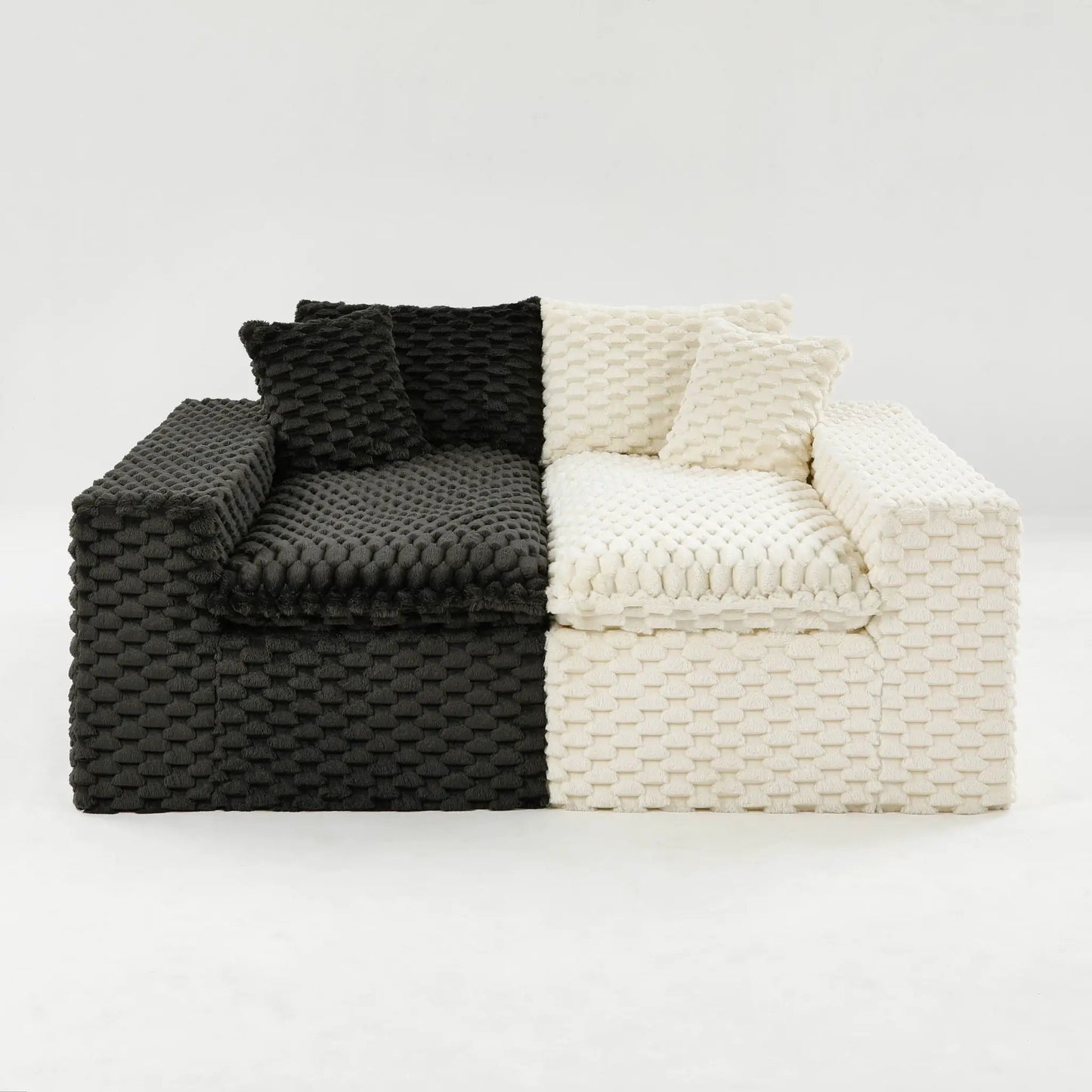 Knitted sofa throws in black and ivory stacked on a sofa, chunky textured weave on Tampa Home & Garden Store