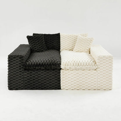 Knitted sofa throws in black and ivory stacked on a sofa, chunky textured weave on Tampa Home & Garden Store