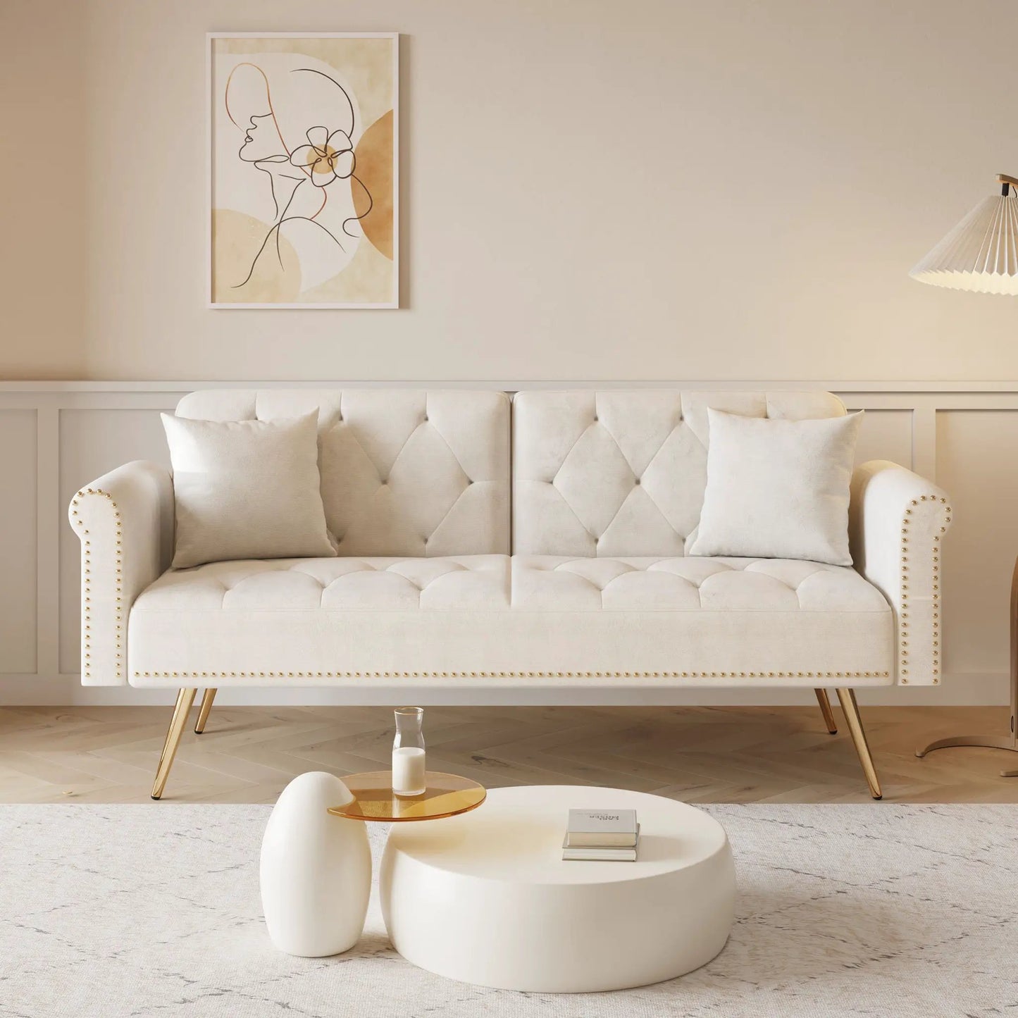 Futon sofa bed by Unique Piece Furniture in white tufted fabric with nail head trim and matching pillows on Tampa Home & Garden Store