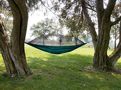 Hammock Tent by River Country Gear in teal suspended between two trees over a green lawn on Tampa Home & Garden Store