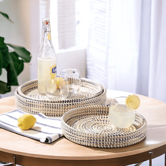 Seagrass trays natural handwoven, nested on a light wood table with lemons and glasses on Tampa Home & Garden Store