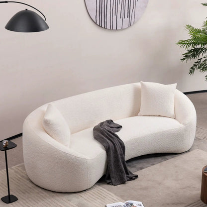 Curved 3 Seater Sofa in white boucle by Unique Piece Furniture; stationary living room sofa with dark gray throw on Tampa Home & Garden Store