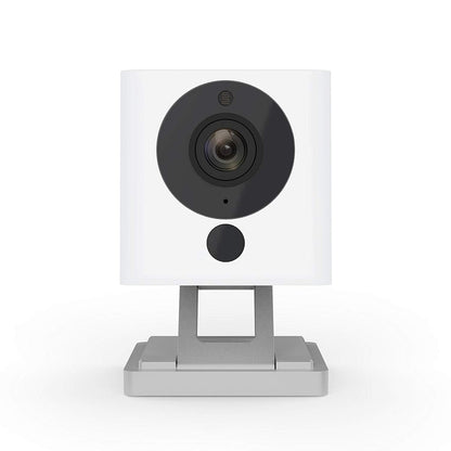Wireless smart home camera white housing with dark lens on metal stand on Tampa Home & Garden Store