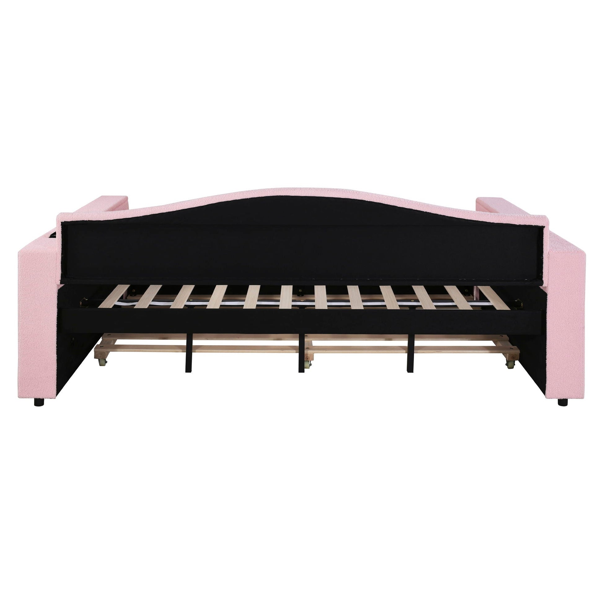 Upholstered pink daybed frame with black back panel, exposed wooden slats and caster wheels on Tampa Home & Garden Store