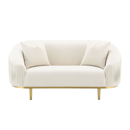 Ivory velvet loveseat with two pillows, gold metal legs and curved arms on Tampa Home & Garden Store