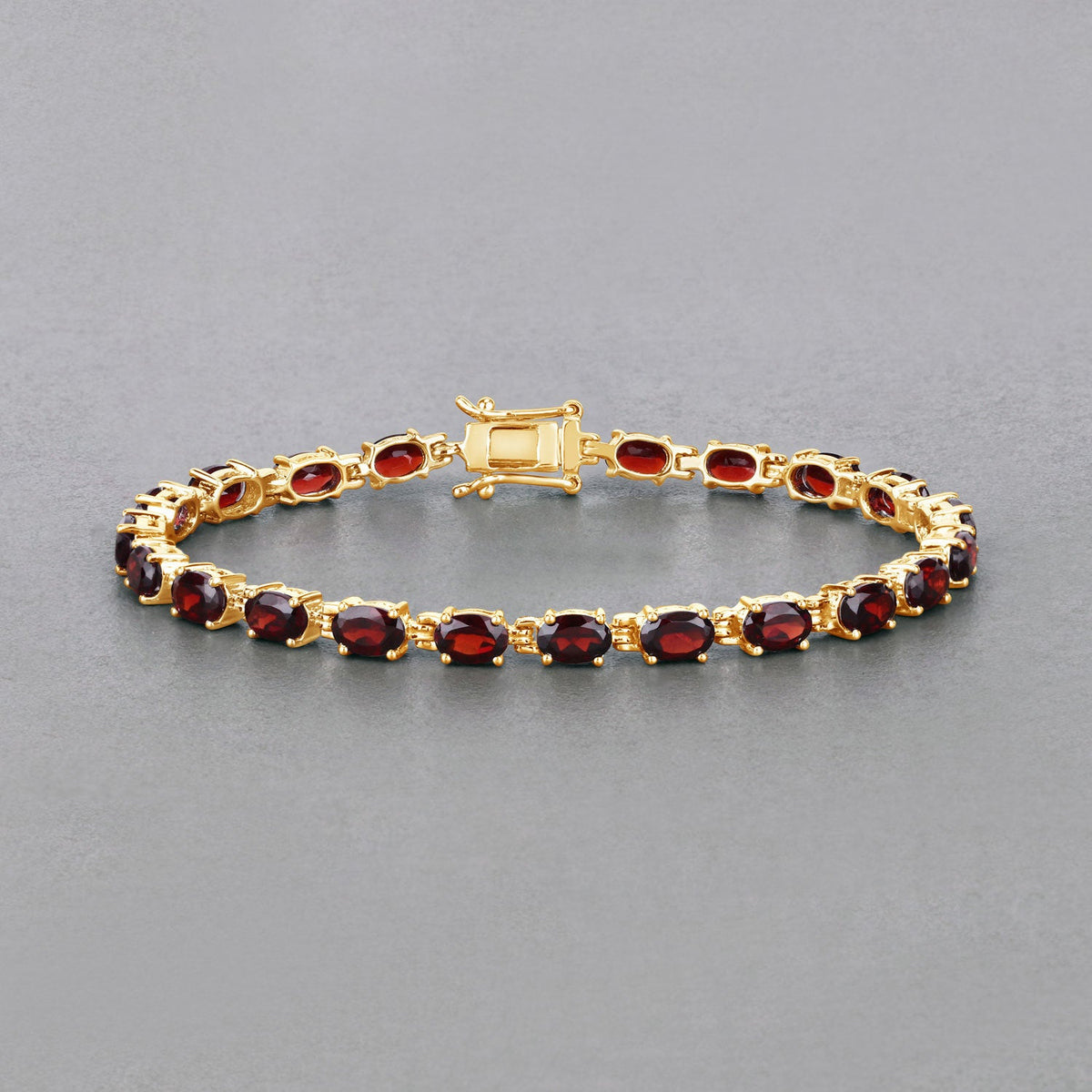 Garnet bracelet with oval red stones in gold-tone setting on Tampa Home & Garden Store