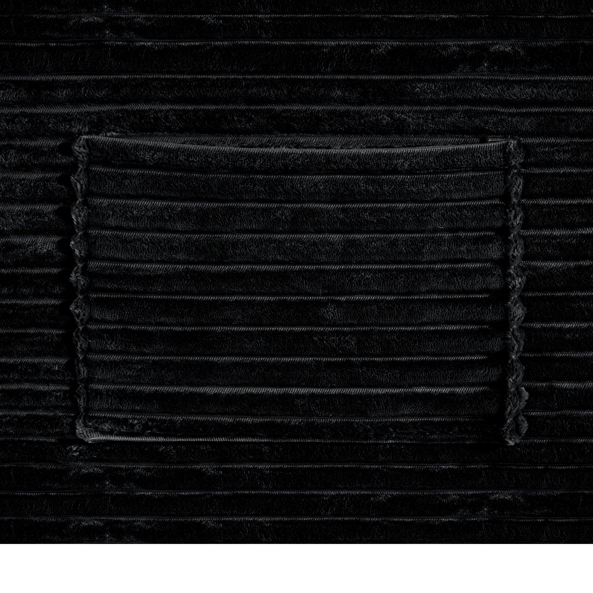 Sectional sofa fabric close-up in black textured material with visible stitching on Tampa Home & Garden Store