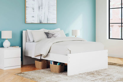 Onita panel platform bed in white with under-bed storage in a teal bedroom on Tampa Home & Garden Store