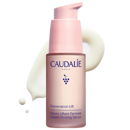 Caudalie Resveratrol-Lift facial serum bottle with pink pump, pink gradient container and grape logo on Tampa Home & Garden Store